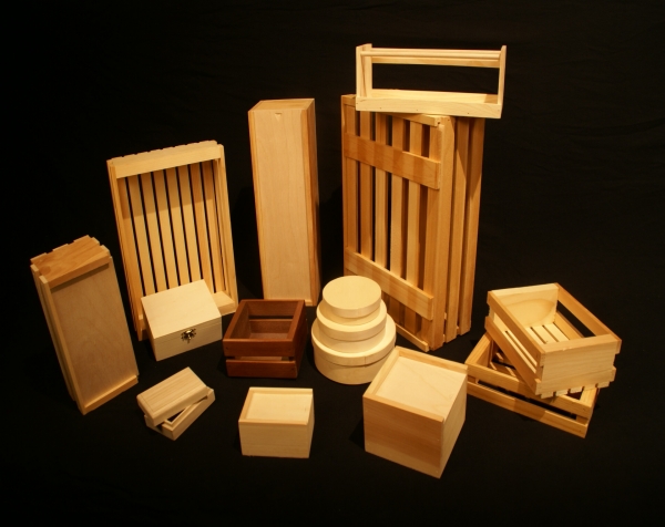 Variety of wood boxes and wood crates. Some wooden slatted boxes, others are small wooden hinged top boxes and wooden slide top boxes